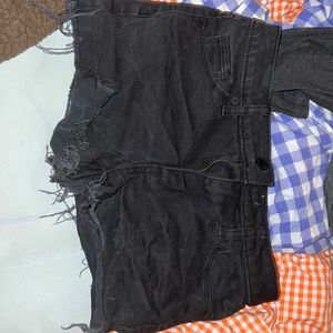 Black flared shorts.